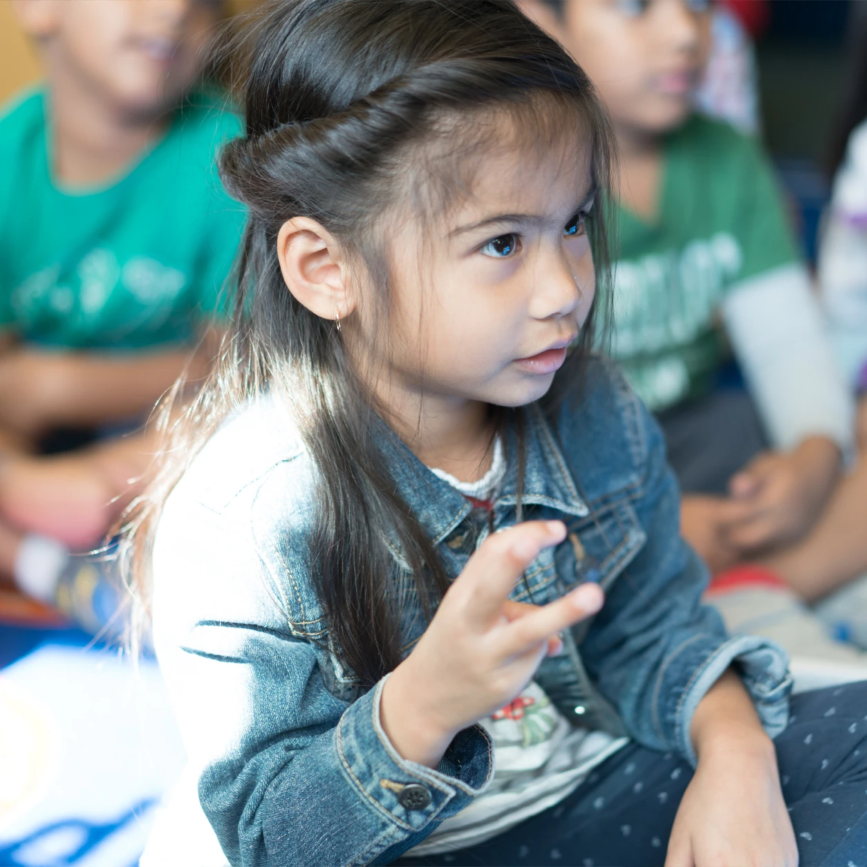 A child during circle time at Magic Hours