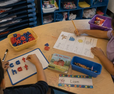Children practicing letters and spelling words